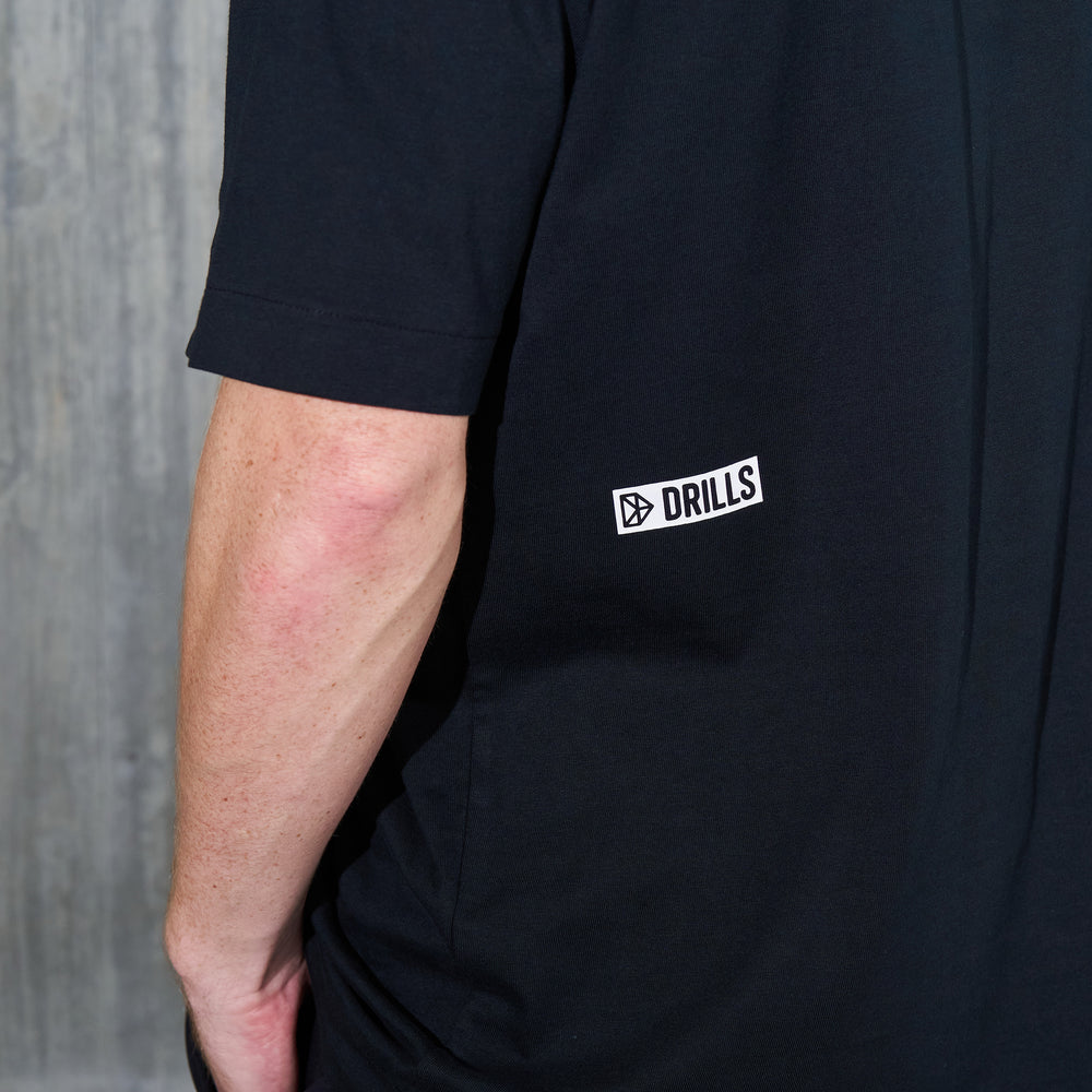 
                      
                        RECREATION DRILLS D-Logo Graphic Tee Black/White
                      
                    