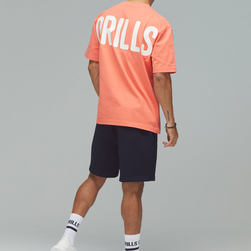 
                      
                        RECREATION DRILLS Bold Graphic Tee Sunset Glow/White
                      
                    