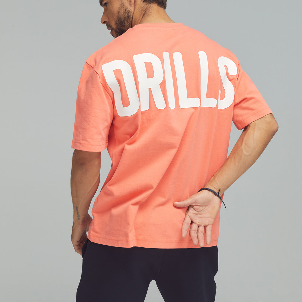 
                      
                        RECREATION DRILLS Bold Graphic Tee Sunset Glow/White
                      
                    