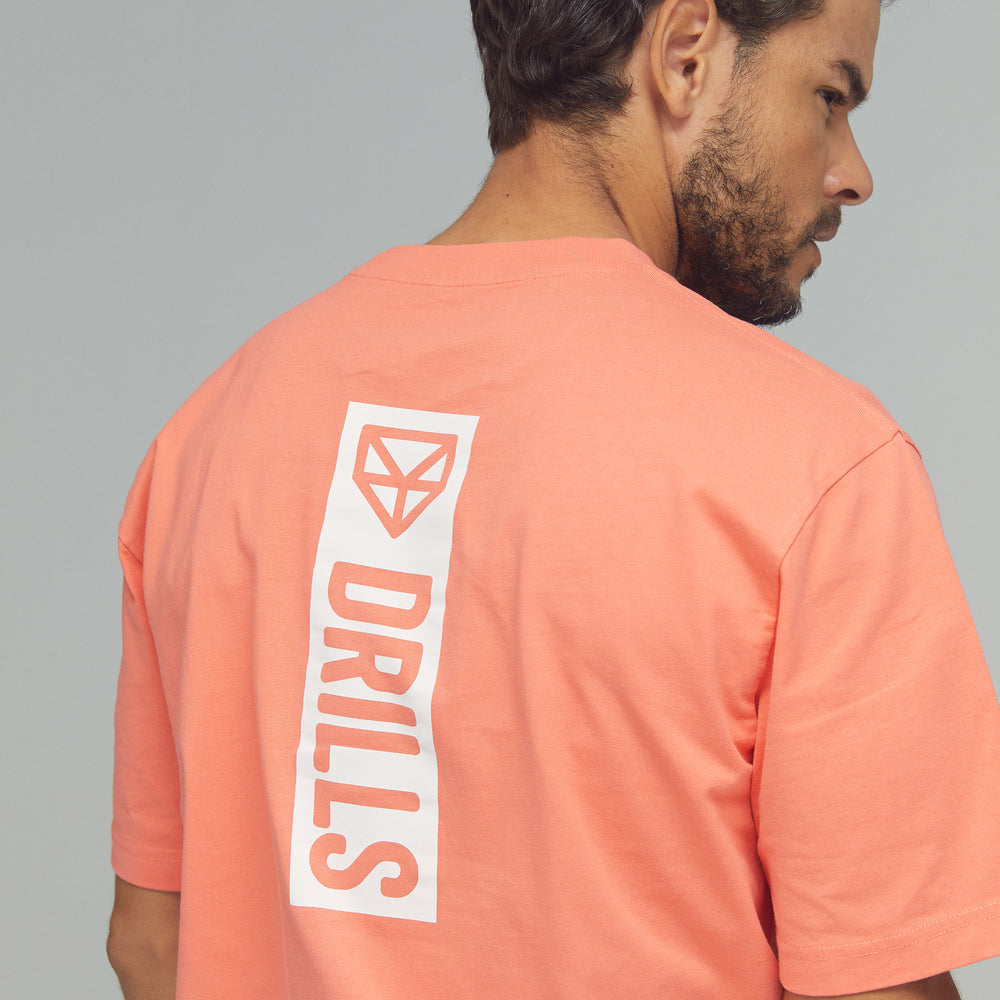 
                      
                        RECREATION DRILLS Vertical Graphic Tee Sunset Glow/White
                      
                    