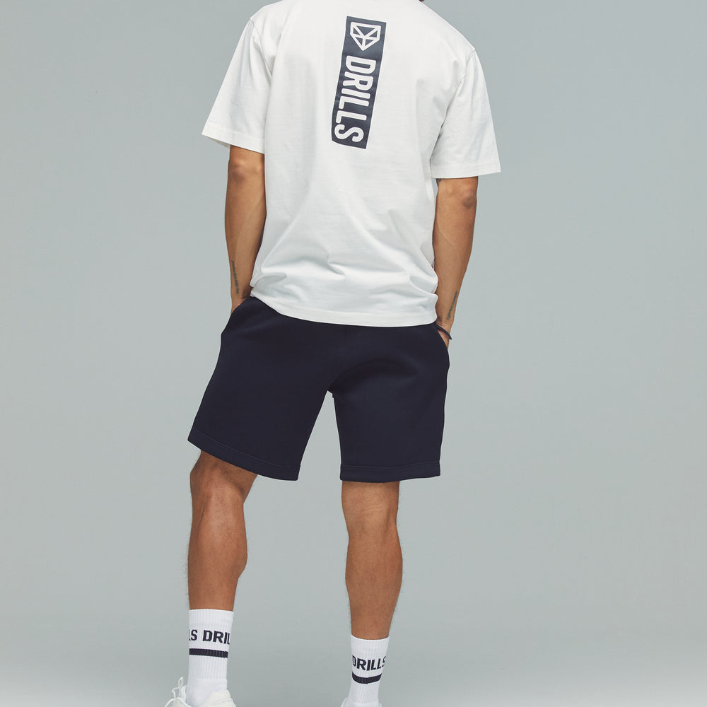 
                      
                        RECREATION DRILLS Vertical Graphic Tee White/Black
                      
                    